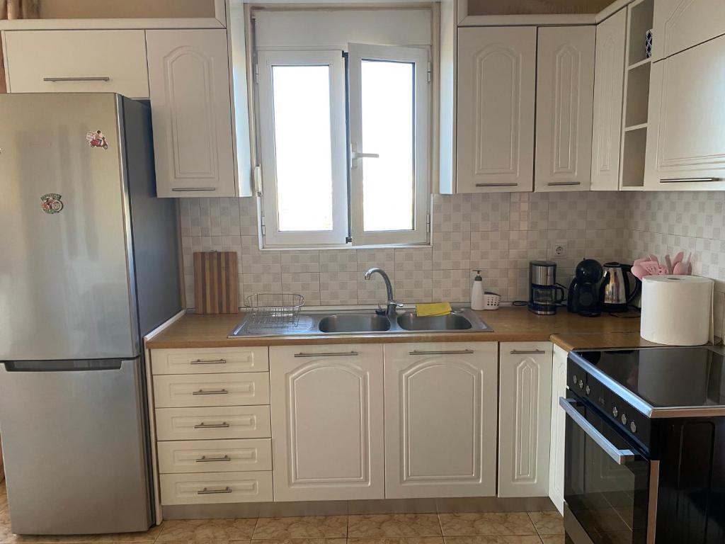 Kuchyň nebo kuchyňský kout v ubytování MARIA cozy apartments
