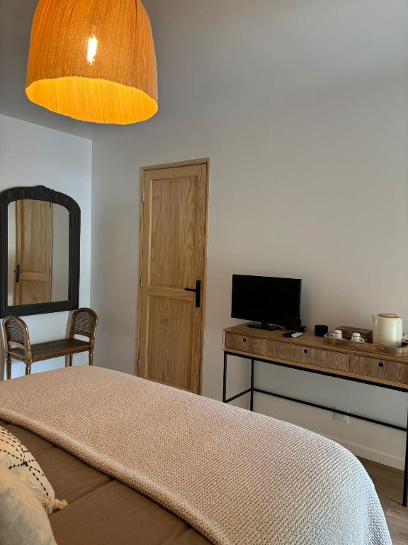 Postel nebo postele na pokoji v ubytování Chambres d'Hôtes En Aparté