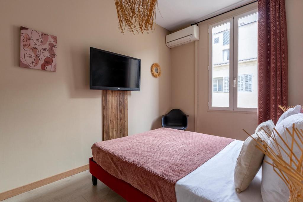 Postel nebo postele na pokoji v ubytování Au cœur du Vieux-Port