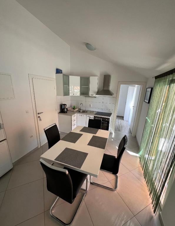 Kuchyň nebo kuchyňský kout v ubytování Sunce apartments