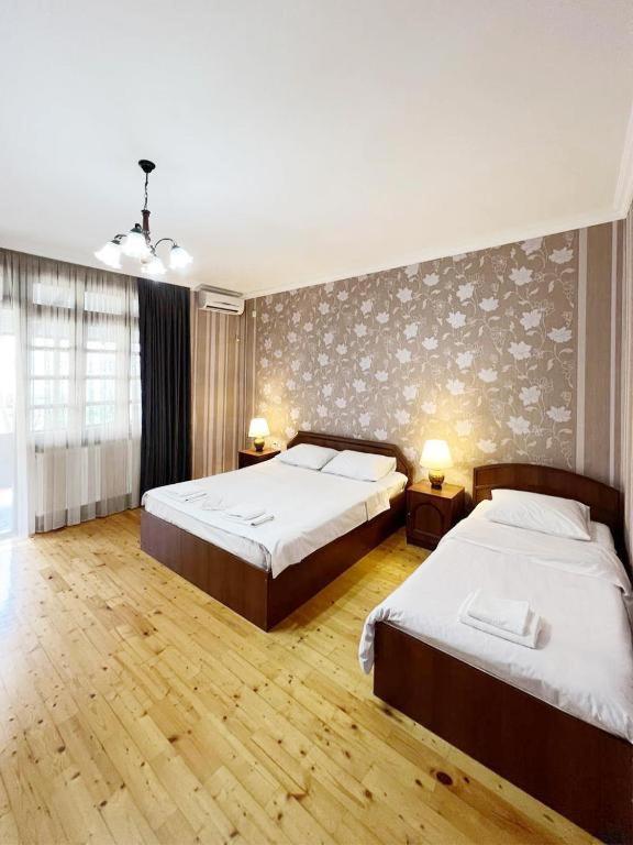 Postel nebo postele na pokoji v ubytování Savane hotel
