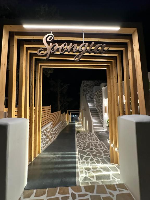 a walkway with a sign that reads spartacus at SPONGIA HOTEL AND SUITES in Myrties