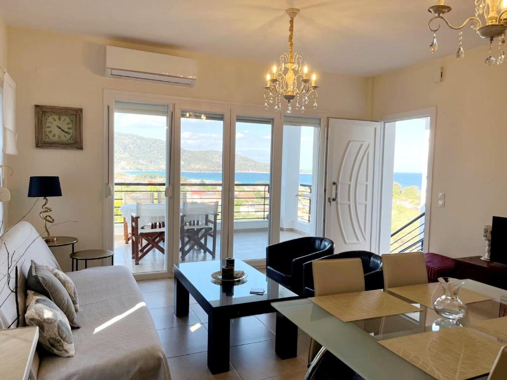 a living room with a couch and a table at Bel Air in Skala Potamias