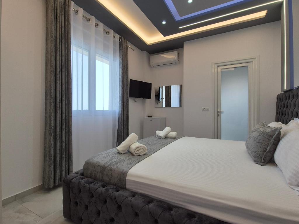 Ένα ή περισσότερα κρεβάτια σε δωμάτιο στο Vila Roxhest