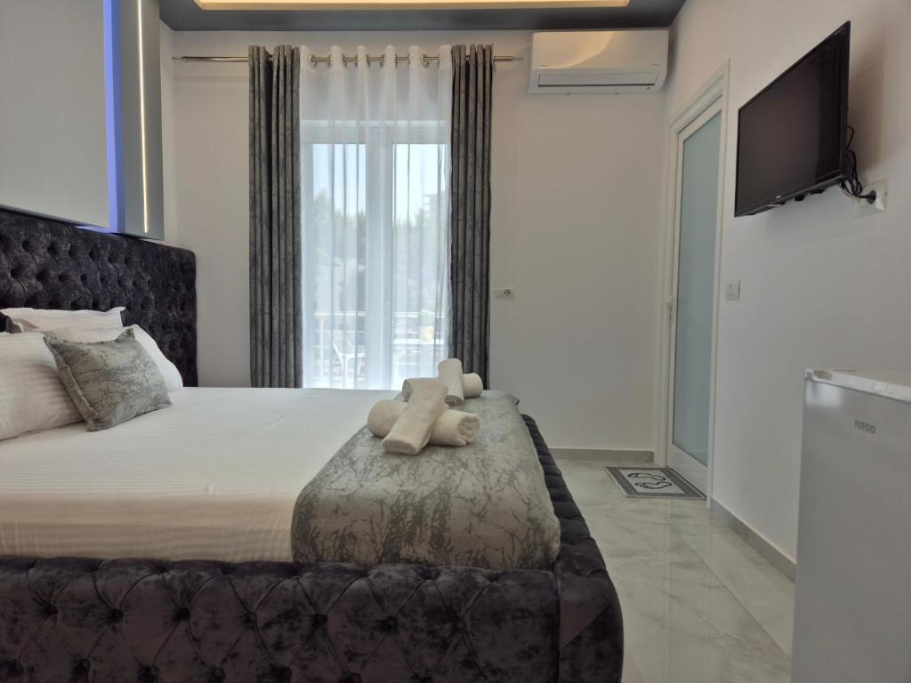 Ένα ή περισσότερα κρεβάτια σε δωμάτιο στο Vila Roxhest