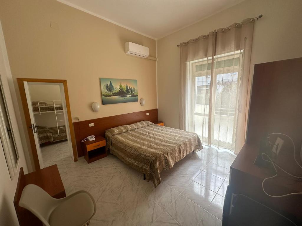 Postel nebo postele na pokoji v ubytování Hotel Germania
