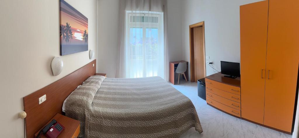 Postel nebo postele na pokoji v ubytování Hotel Germania