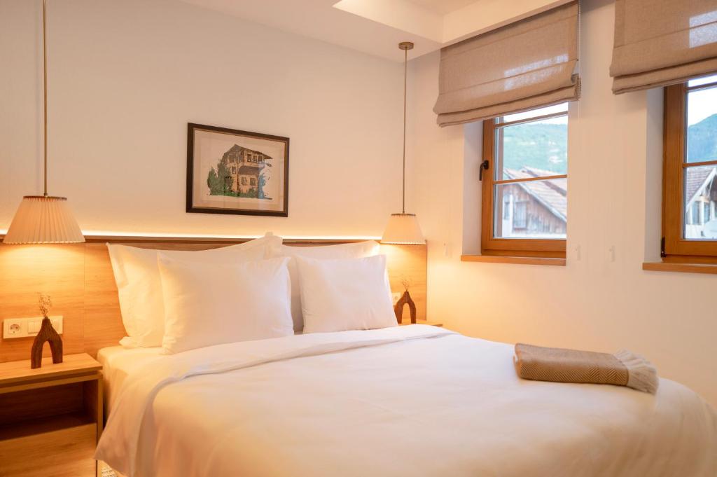 Postel nebo postele na pokoji v ubytování Hotel Baškuća Sarajevo