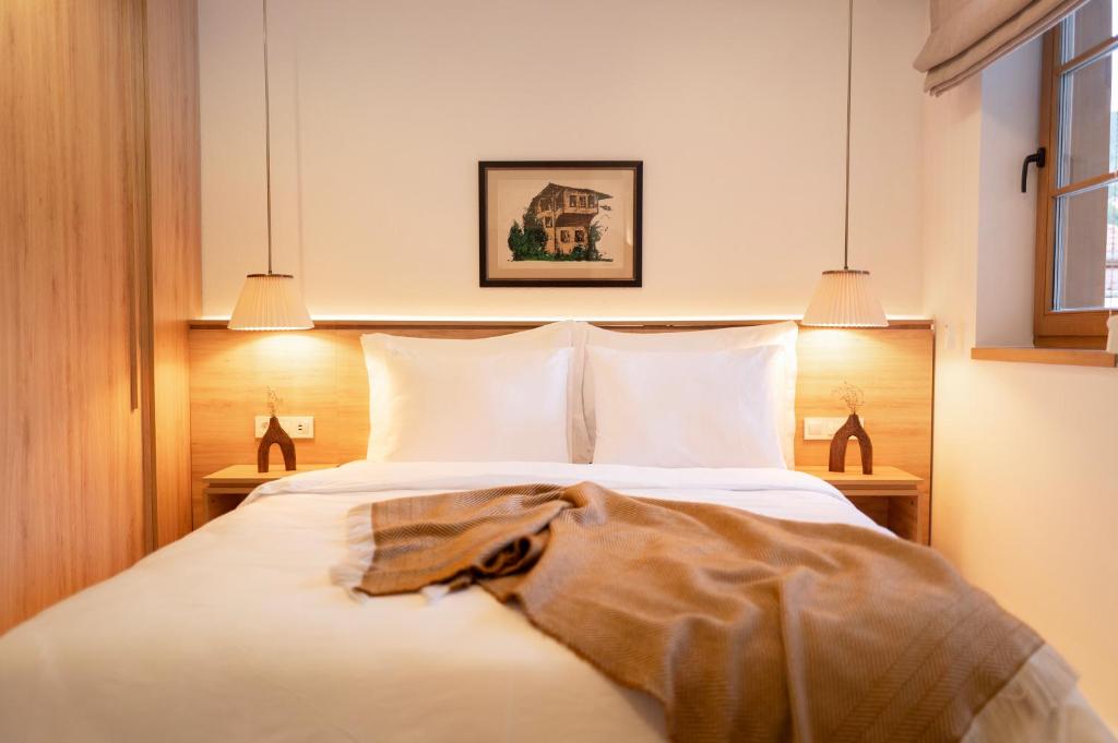 Postel nebo postele na pokoji v ubytování Hotel Baškuća Sarajevo