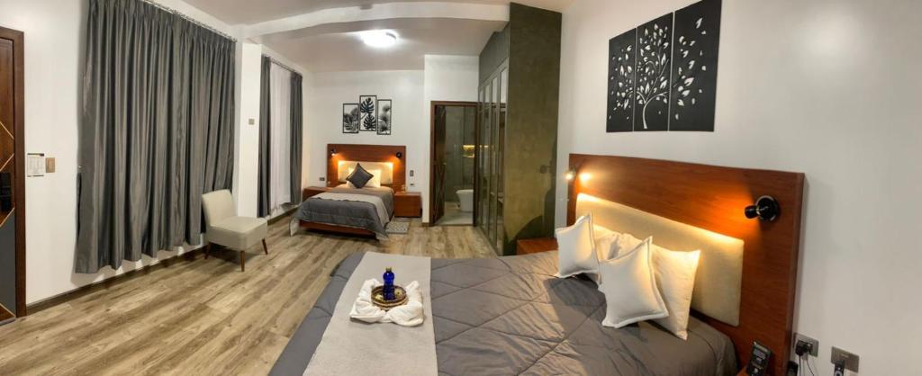 Postel nebo postele na pokoji v ubytování Hotel Sacha Golden