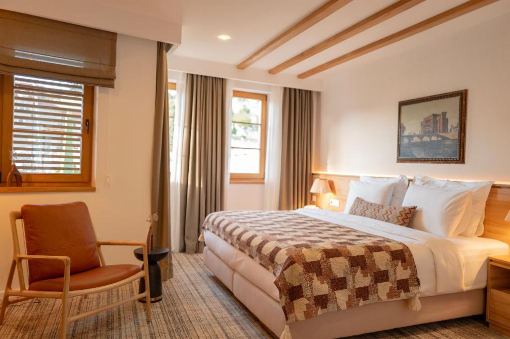 Postel nebo postele na pokoji v ubytování Hotel Baškuća Sarajevo