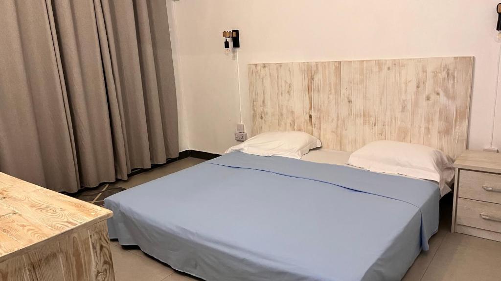 Postel nebo postele na pokoji v ubytování Ebony Apartment & Studio