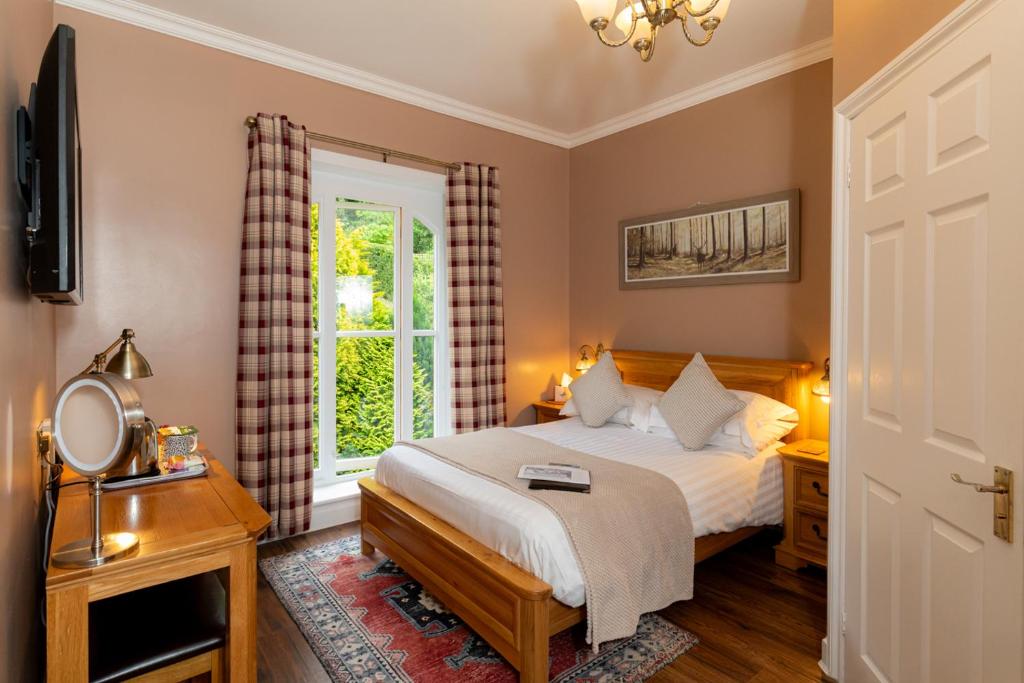 Postel nebo postele na pokoji v ubytování Coalbrookdale Villa