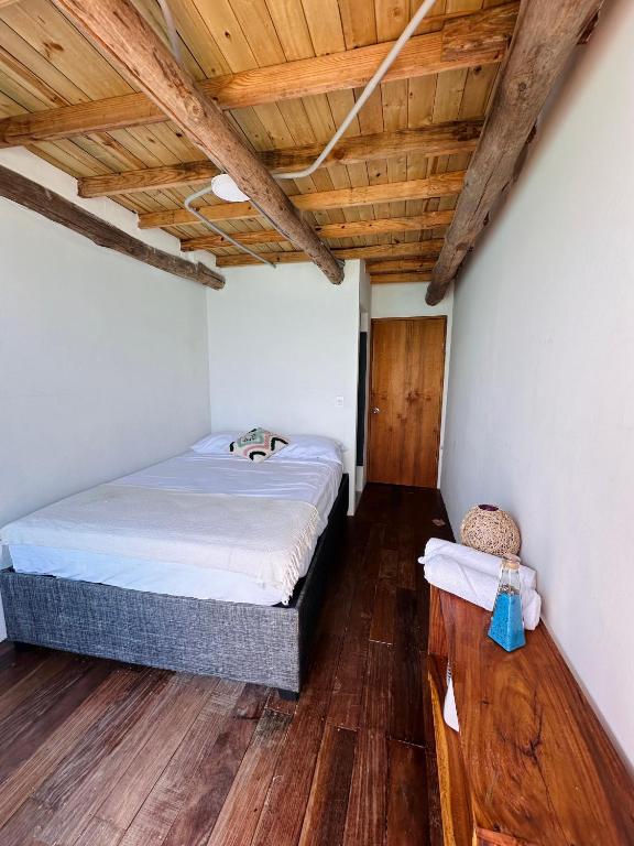 Postel nebo postele na pokoji v ubytování Itaca Eco House