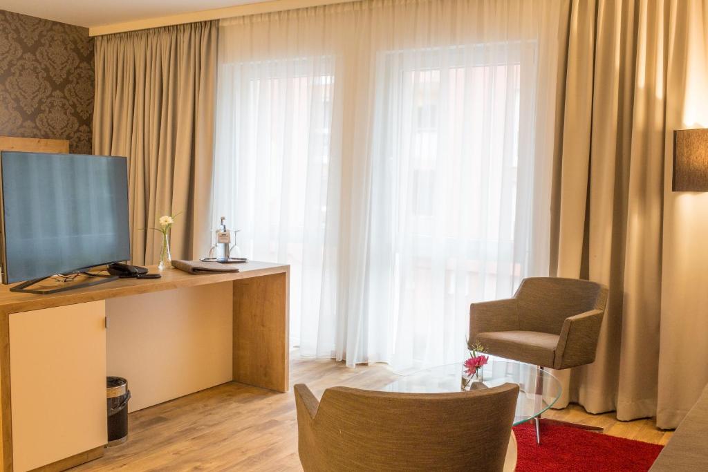 TV a/nebo společenská místnost v ubytování DasSchaffers - MeinWohlfühlhotel