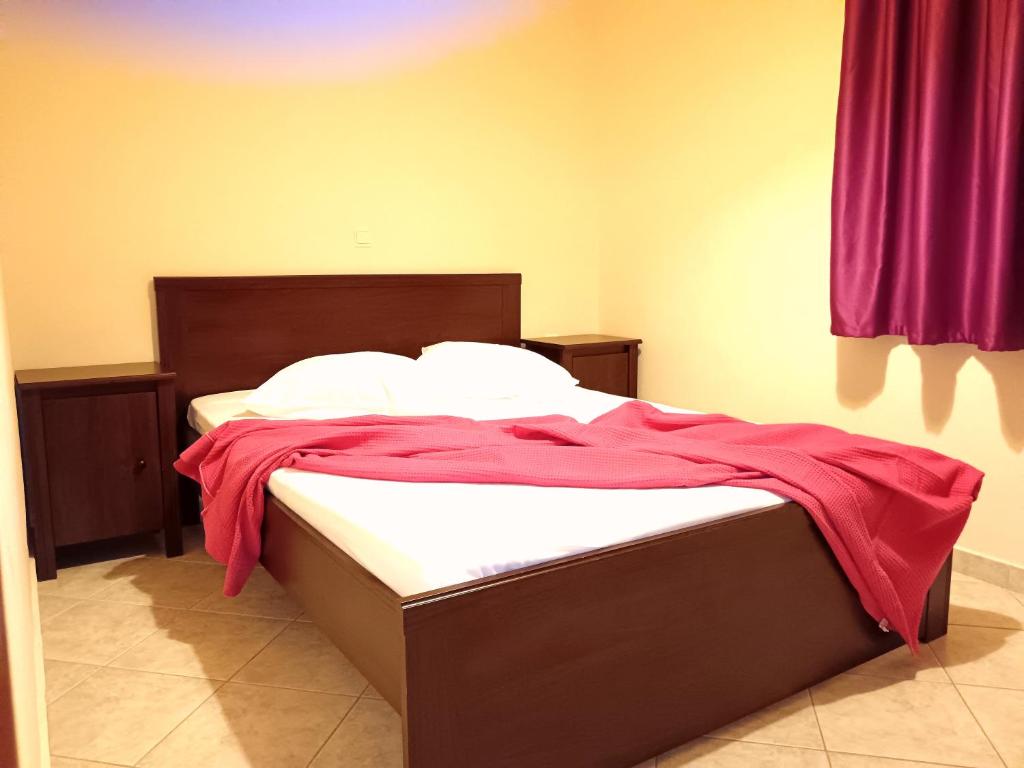 Postel nebo postele na pokoji v ubytování Giorgos Apartments.