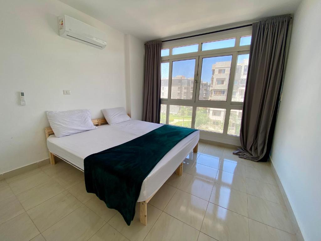 Postel nebo postele na pokoji v ubytování Hotel Apartment Madinaty