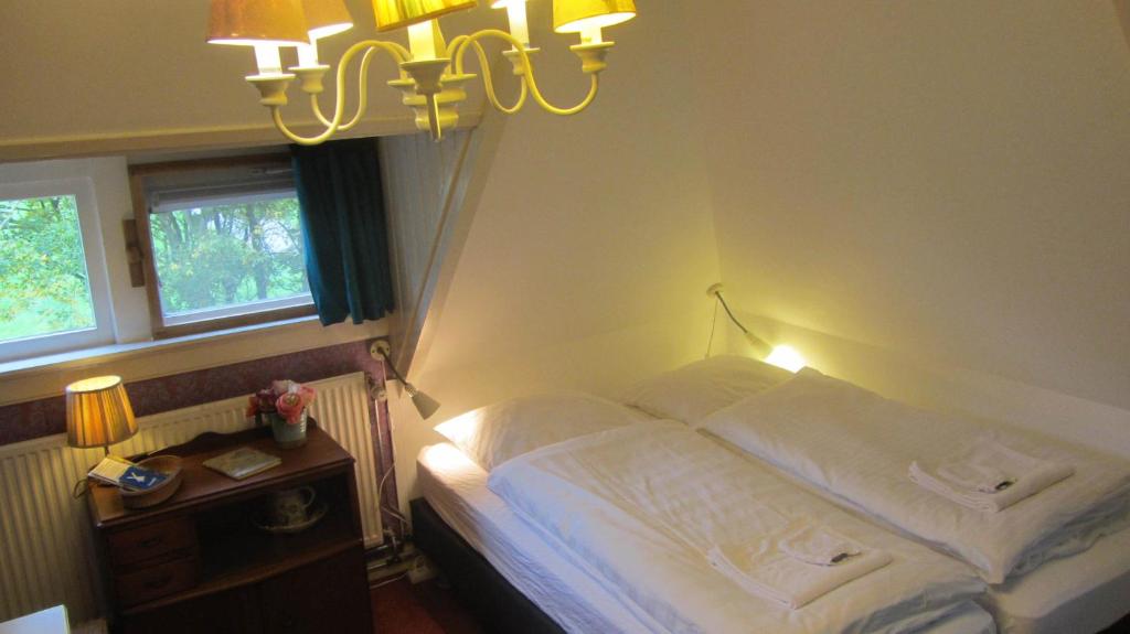 Postel nebo postele na pokoji v ubytování Villa Zomerdijk