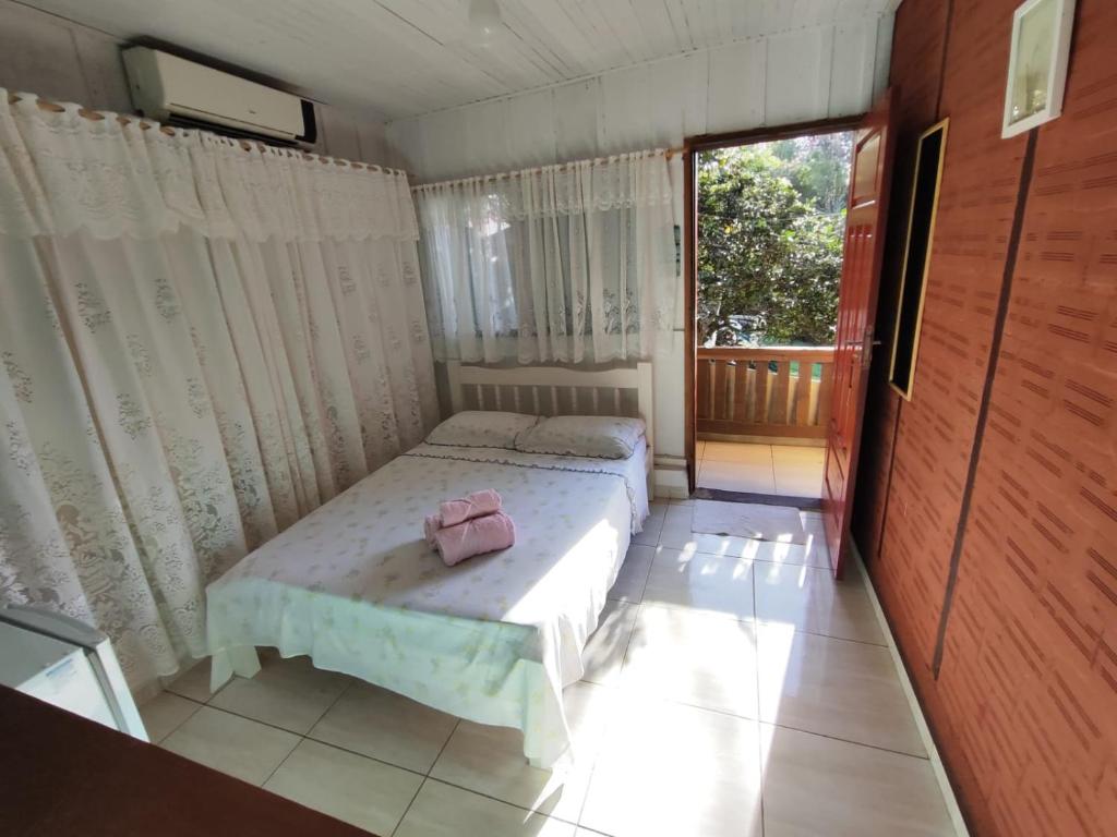 Cama ou camas em um quarto em Pousada Do Chicão