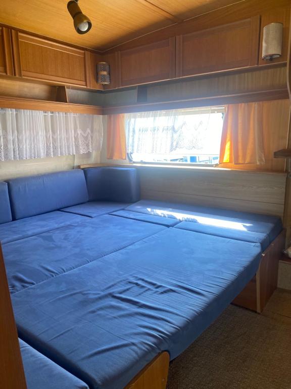 Postel nebo postele na pokoji v ubytování AMOMEA CAMP