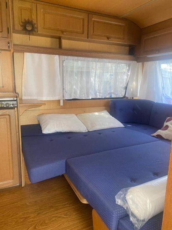Postel nebo postele na pokoji v ubytování AMOMEA CAMP
