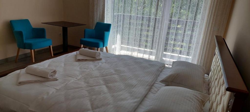 Postel nebo postele na pokoji v ubytování Spa Hotel Alpin