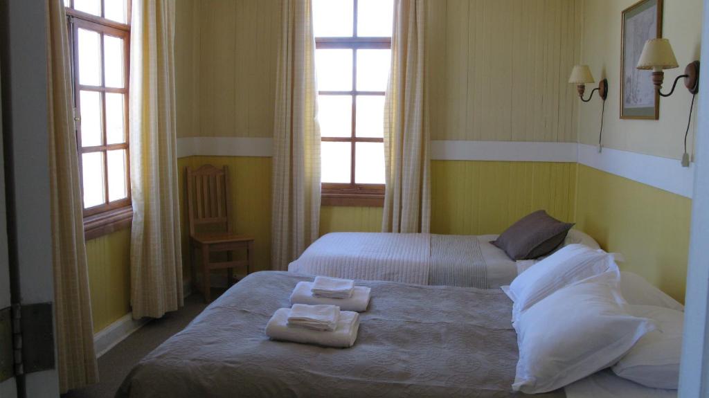 Postel nebo postele na pokoji v ubytování Yendegaia House