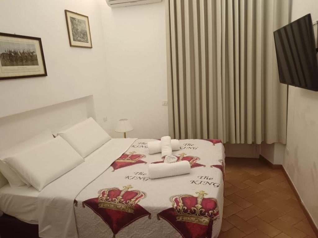 Postel nebo postele na pokoji v ubytování STAR HOTEL ROMA