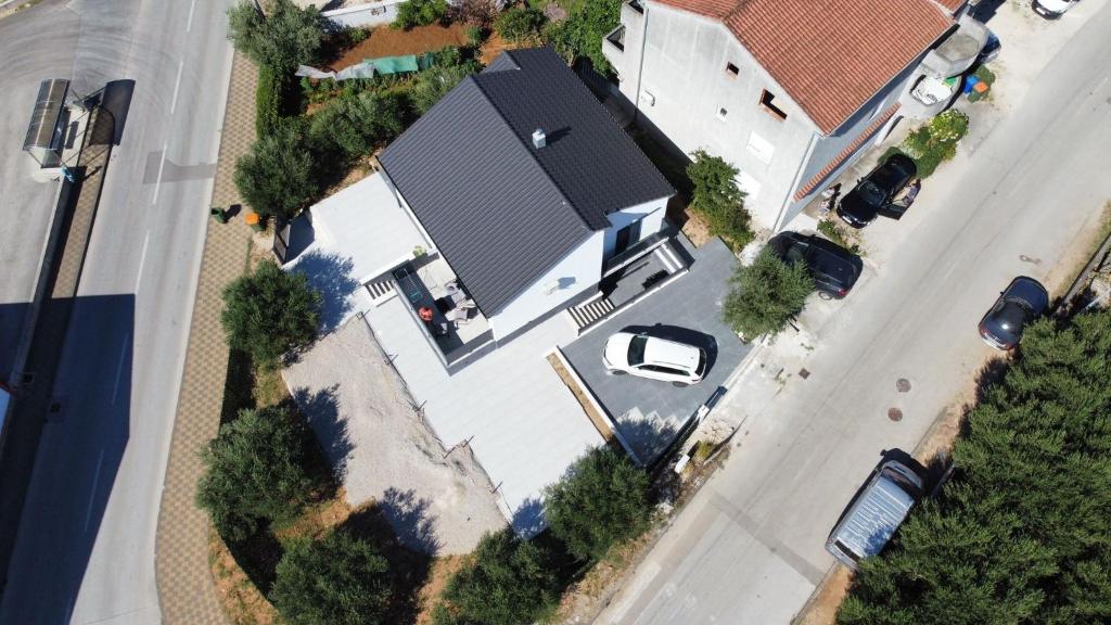 an overhead view of a house with a roof at Family friendly house with a swimming pool Biograd na Moru, Biograd - 23272 in Biograd na Moru
