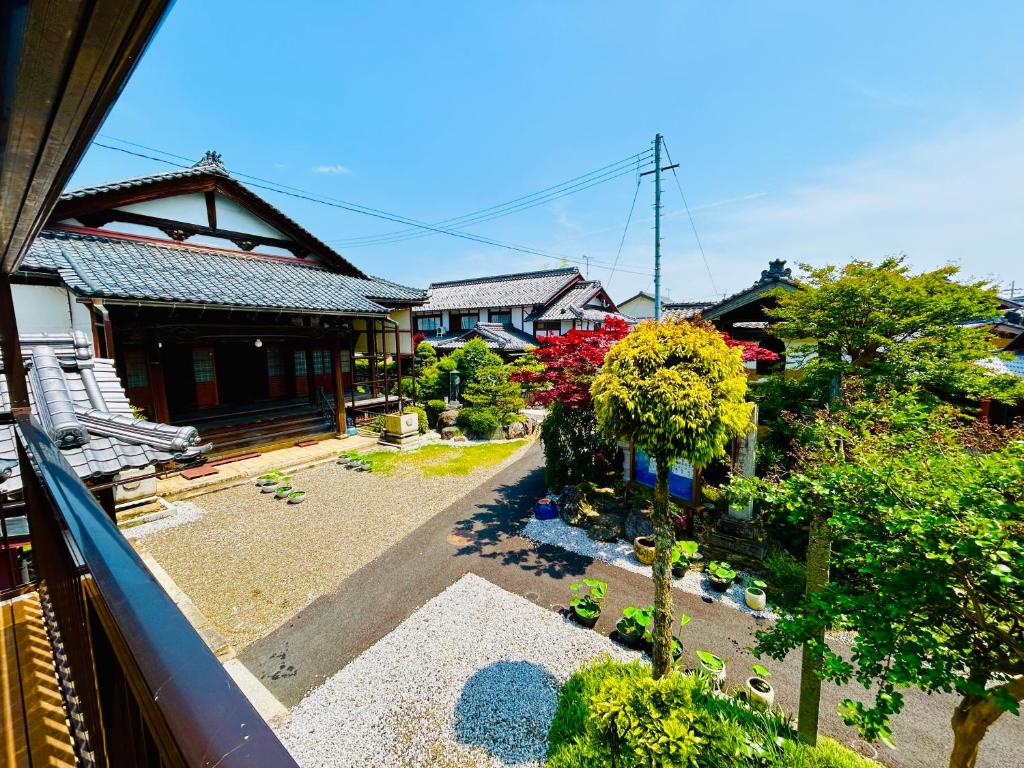 a view from a balcony of a house at 湖北 寺の宿- GuestHouse去-来-現Ko-Rai-Gen in Nagahama