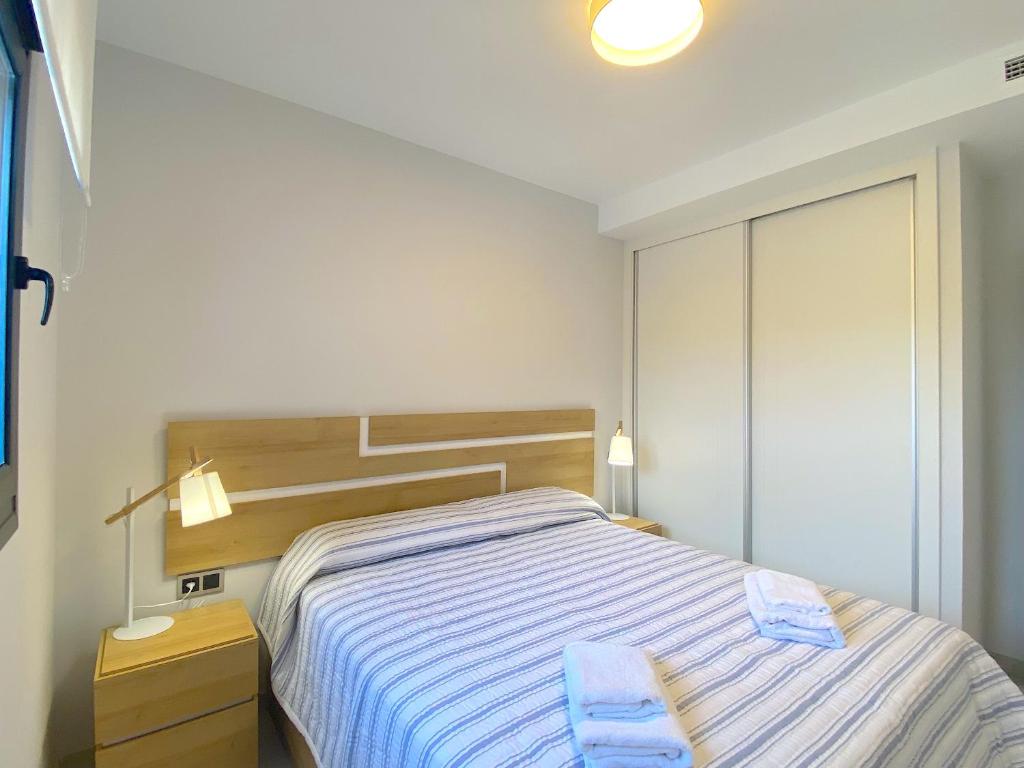 Postel nebo postele na pokoji v ubytování Lujoso apartament con impresionantes vistas al mar