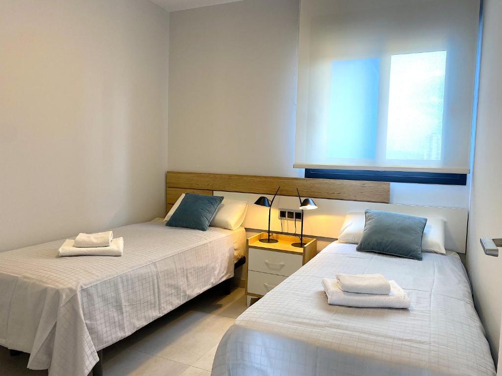 Postel nebo postele na pokoji v ubytování Lujoso apartament con impresionantes vistas al mar