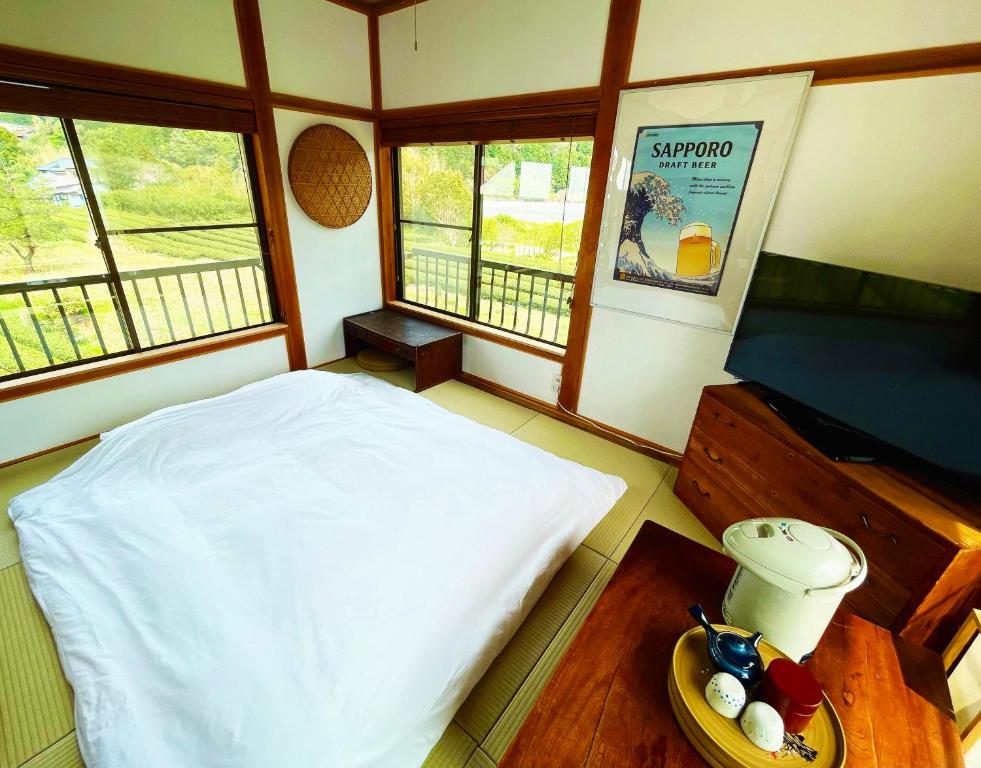 Postel nebo postele na pokoji v ubytování 一棟貸し宿 Kanata Riverview House