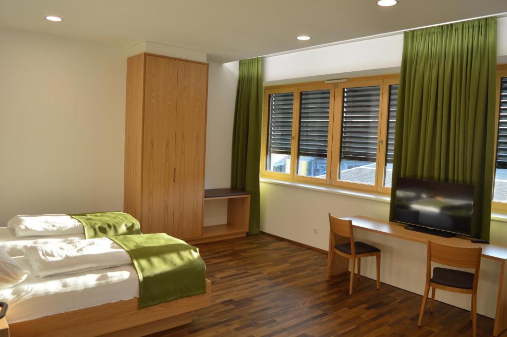 Postel nebo postele na pokoji v ubytování Business Motel Feldkirch