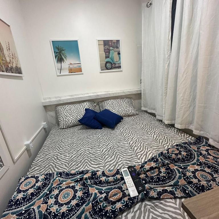 Postel nebo postele na pokoji v ubytování Residencial Napolitan