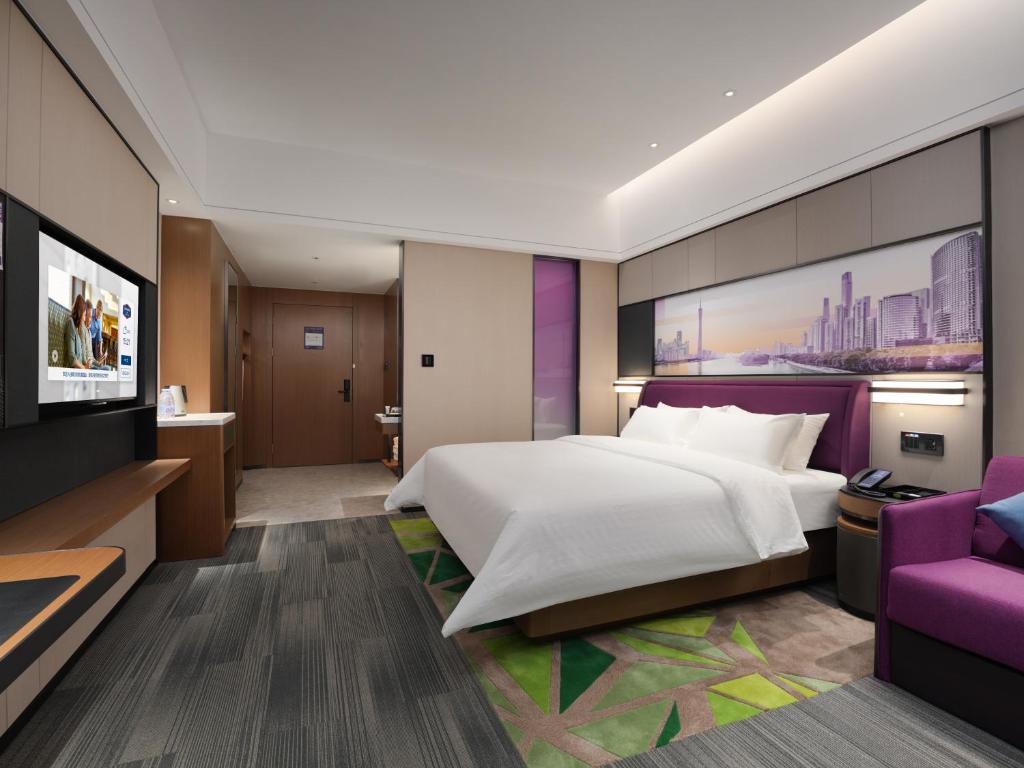 Postel nebo postele na pokoji v ubytování Hampton by Hilton Guangzhou Wenchong