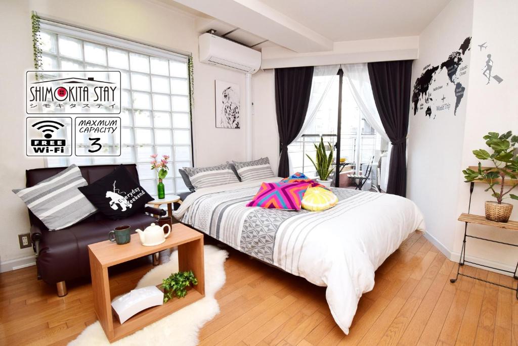 a bedroom with a large bed and a window at KITAZAWA CS HOUSE / Vacation STAY 76588 in Tokyo
