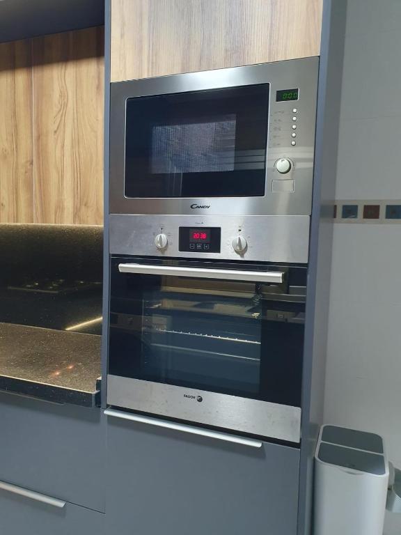 Kuchyň nebo kuchyňský kout v ubytování Le Sélect Appartement