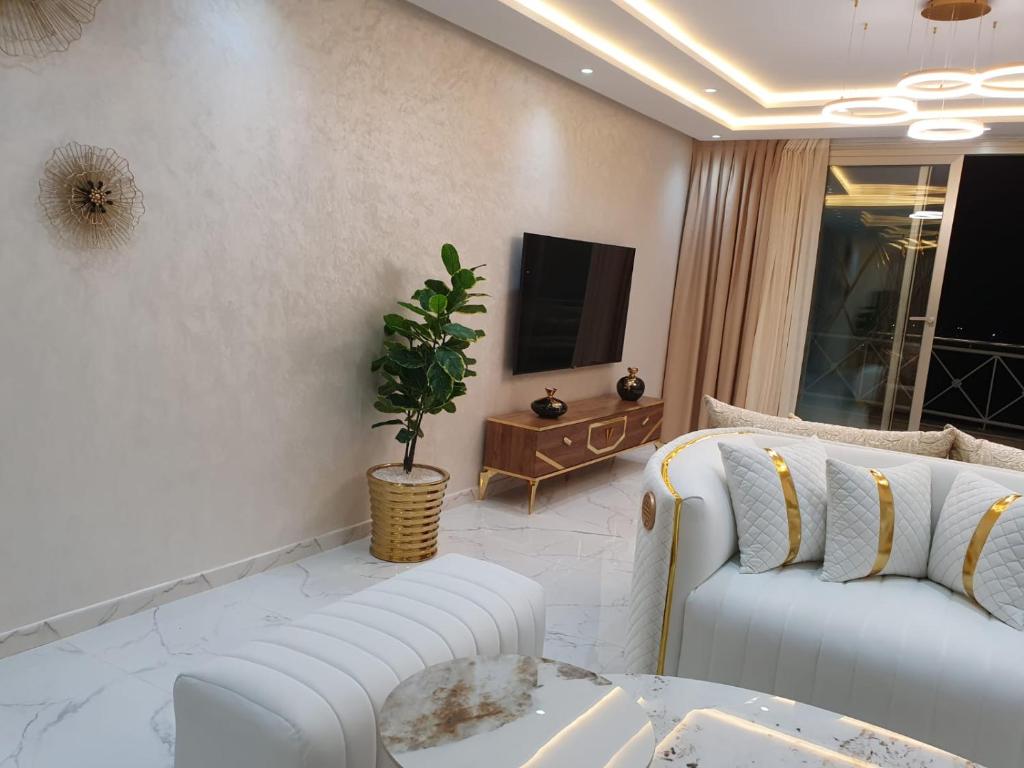 TV a/nebo společenská místnost v ubytování Le Sélect Appartement
