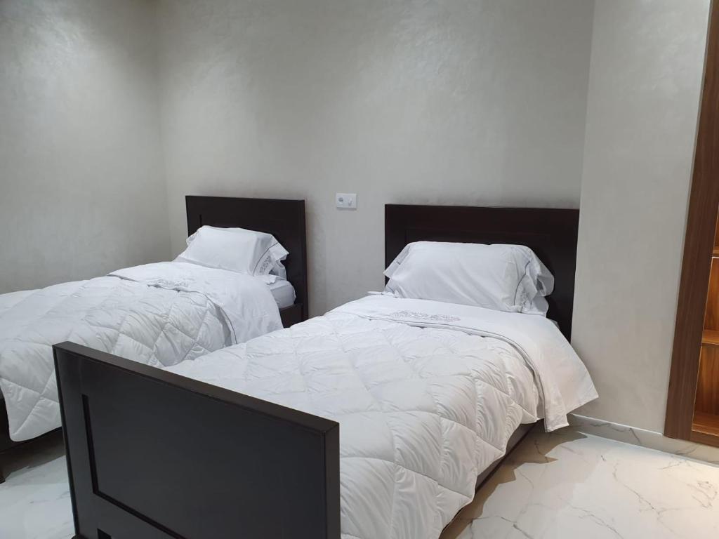 Postel nebo postele na pokoji v ubytování Le Sélect Appartement