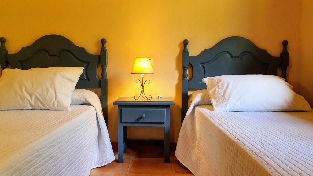 Postel nebo postele na pokoji v ubytování Complejo Rural El Mirador de Ovio