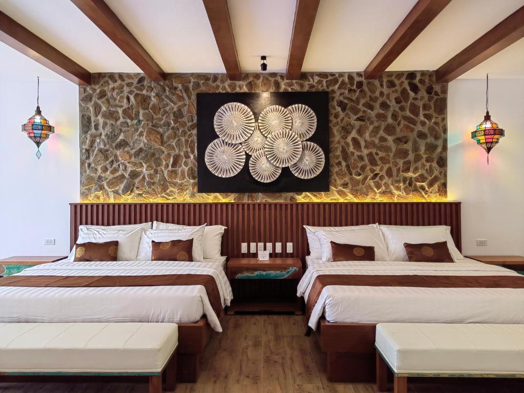 Ένα ή περισσότερα κρεβάτια σε δωμάτιο στο Asri Villas