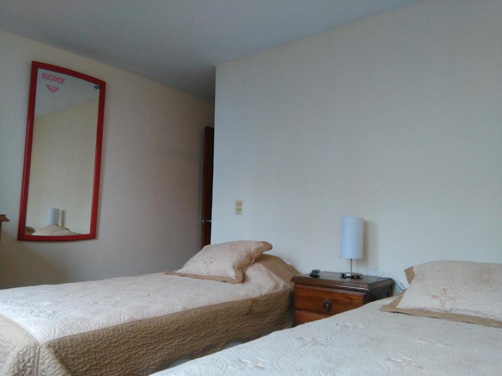 Rúm í herbergi á Inkawasi Miraflores Hostel