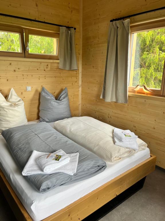 Postel nebo postele na pokoji v ubytování Wald ist Zukunft