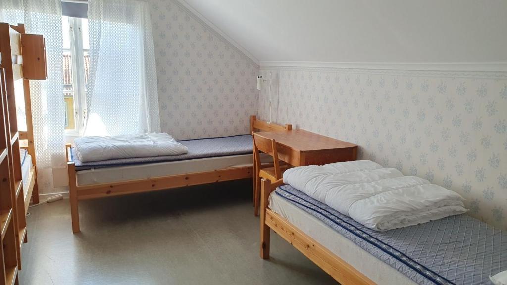 Postel nebo postele na pokoji v ubytování Vandrarhemmet Gammelgården