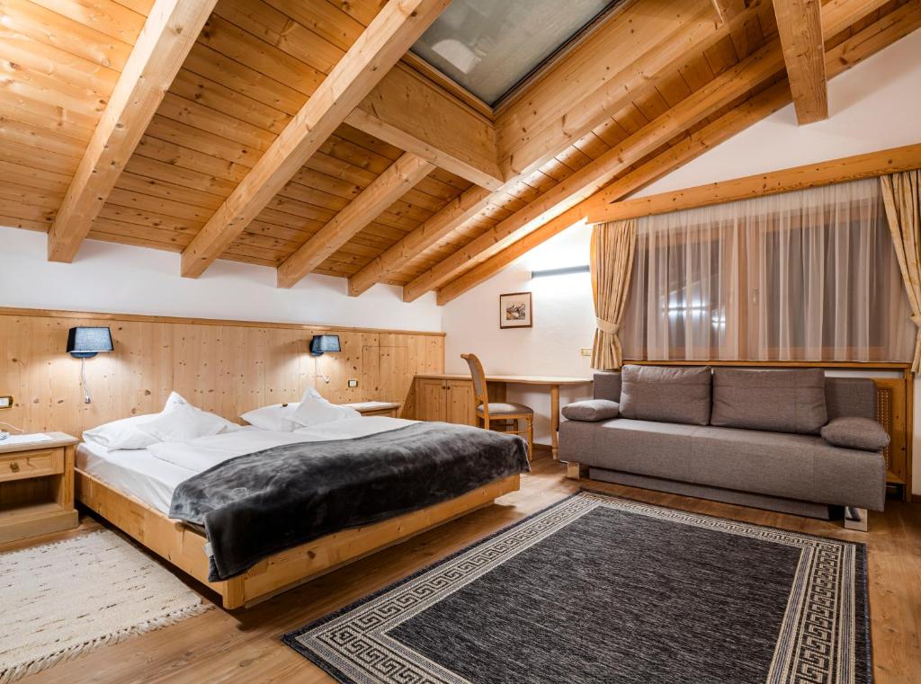Postel nebo postele na pokoji v ubytování Garni Hotel Rosengarten B&B