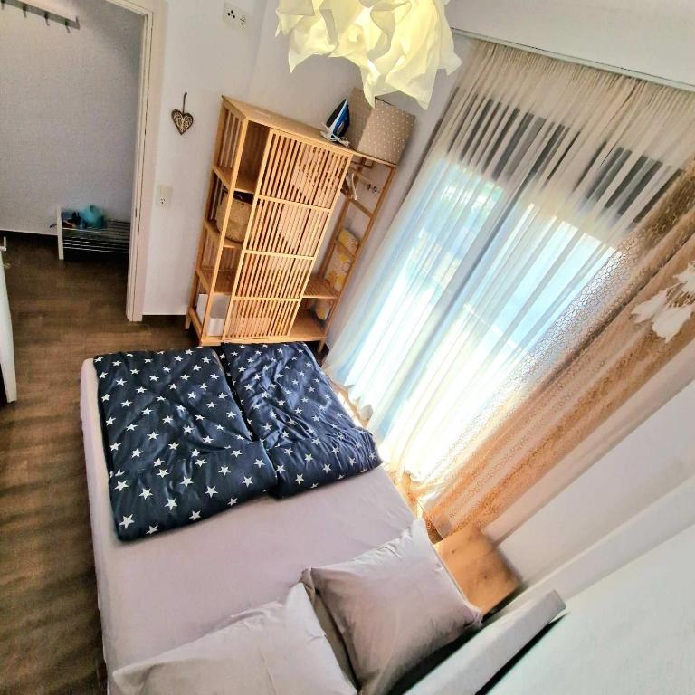 Postel nebo postele na pokoji v ubytování Морска къща ЕММА