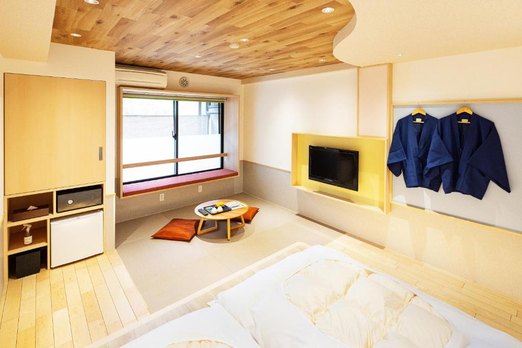 Cama o camas de una habitación en Hidamari Ichinoyu