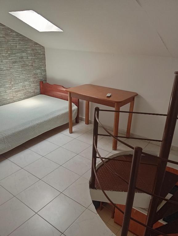 Postel nebo postele na pokoji v ubytování Apartments Gregory & George