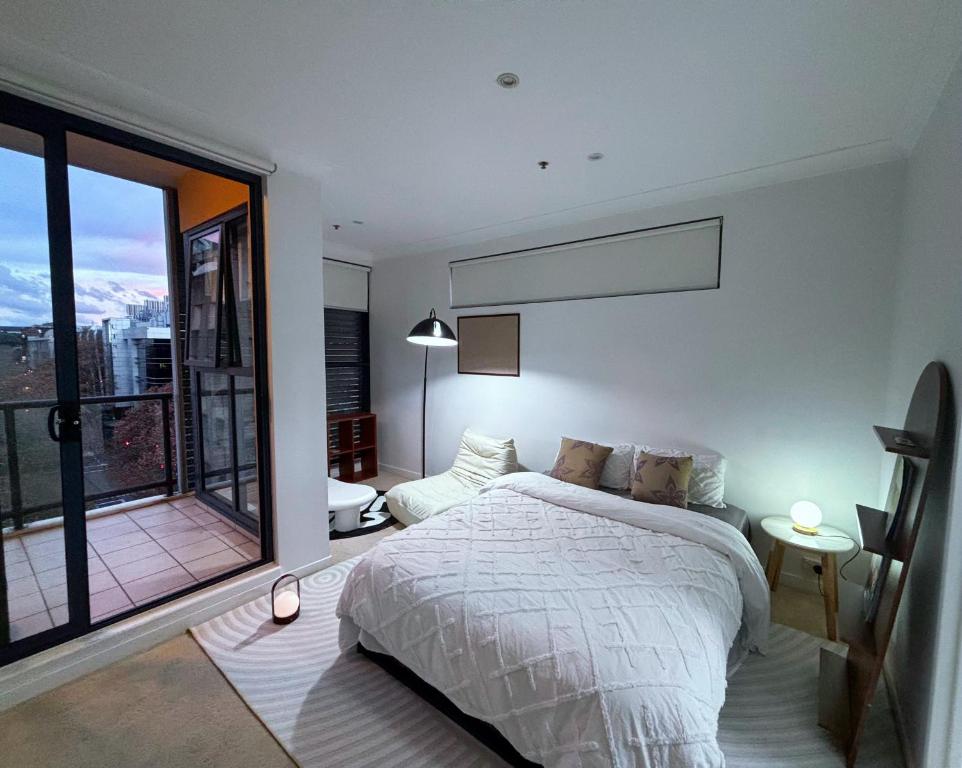 Ένα ή περισσότερα κρεβάτια σε δωμάτιο στο Private room with Balcony